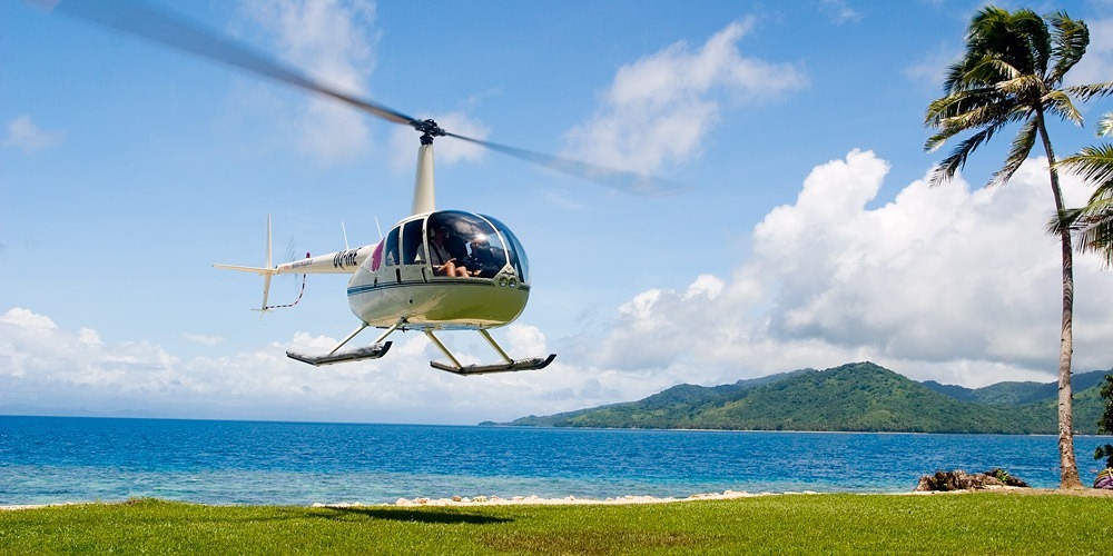 A helicopter landing on the beach